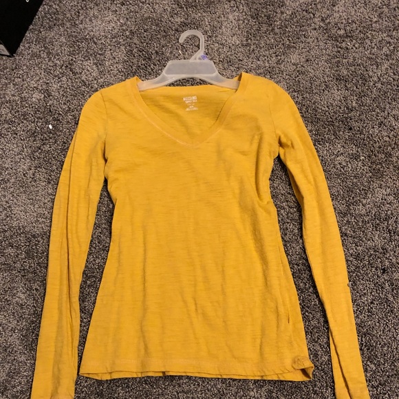mustard colored long sleeve shirt